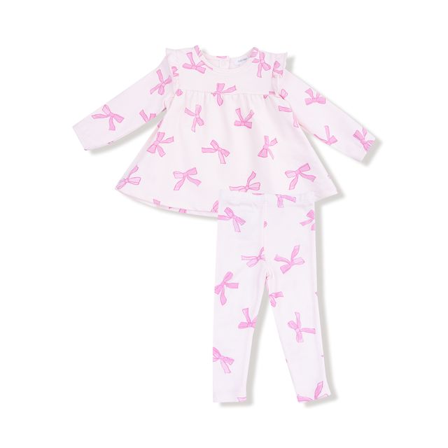 White baby outfit with pink bows on a white background