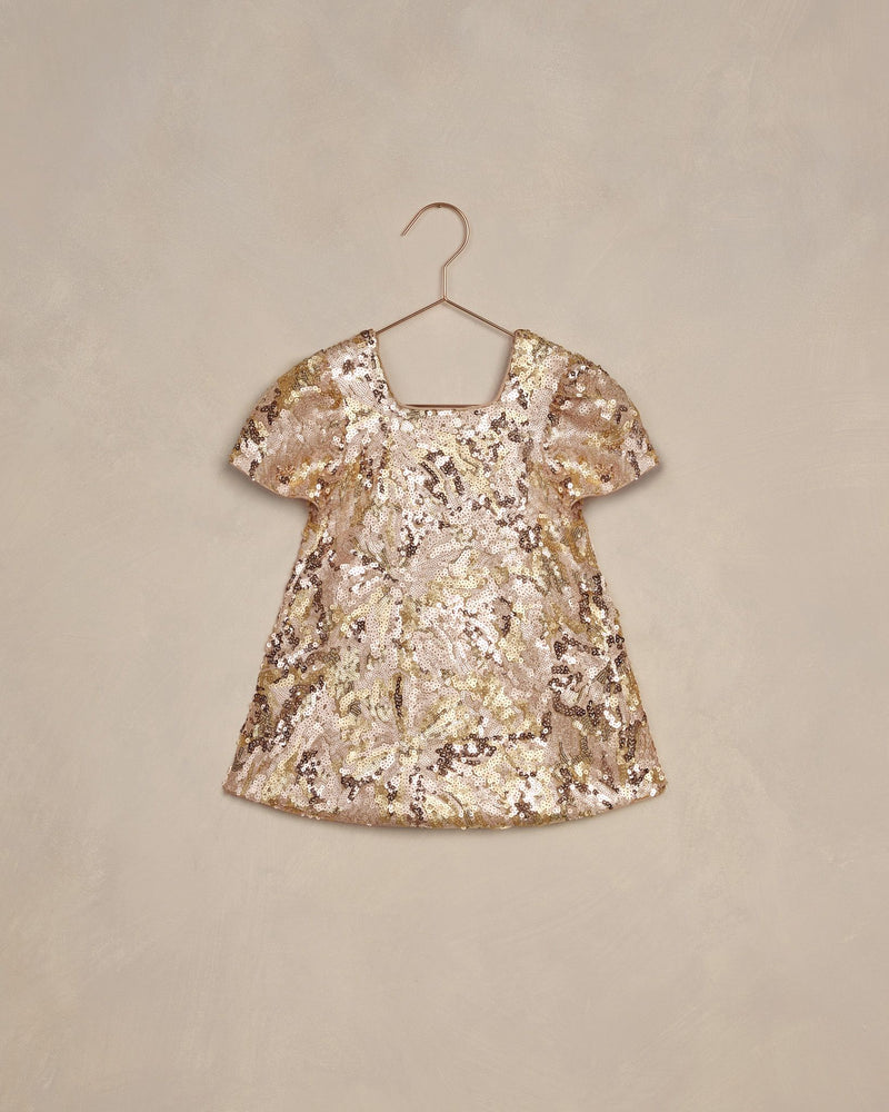 girls dress covered in gold and rose gold sequins