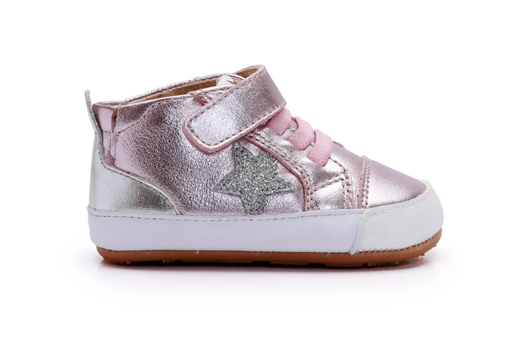 A metallic pink and silver high-top baby sneaker with a glittery star on the side, a hook-and-loop strap closure, and a white midsole, shown against a plain white background.
