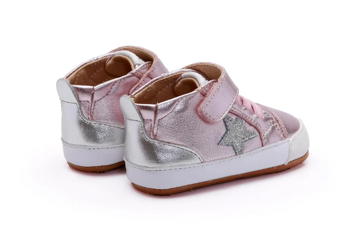 A pair of toddler high-top sneakers in metallic pink and silver, featuring hook-and-loop straps and a glittery star detail on the side, set against a plain white background.
