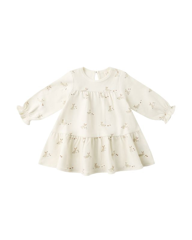 beige dress with small bunny pattern on a white background