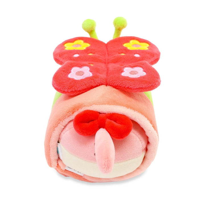 back of kitty dressed as a butterfly, the tail of the kitty has a red bow attached. 