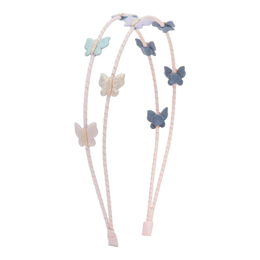 A double-strand light pink braided headband featuring decorative fabric butterfly charms in pastel blue, lavender, and glittery gold, shown against a plain white background.