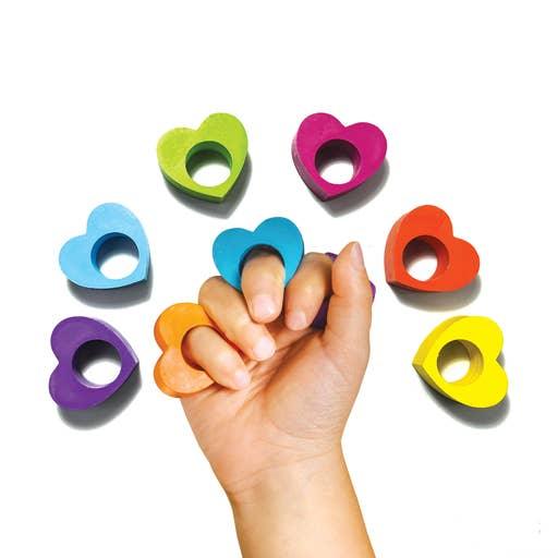 this picture shows a child wearing these heart shaped crayons as rings. they fit the child's fingers. 
