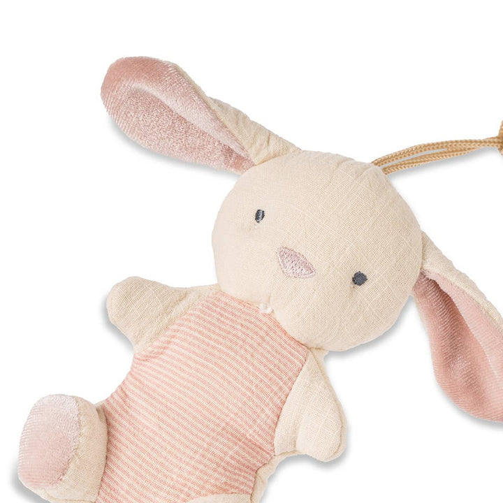 Plush bunny toy with pink and beige colors on a white background