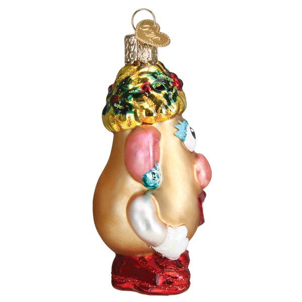 Decorative ornament shaped like a female torso with a Christmas tree on a white background