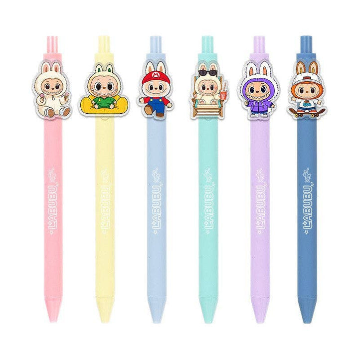 Set of six colorful pens with cartoon character tops on a white background