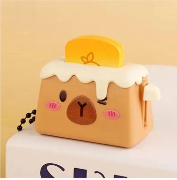 Cute toaster-shaped keychain with a face and bread that you click down into the toaster. 