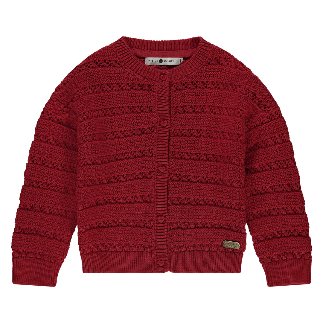 Red knitted cardigan on a white background