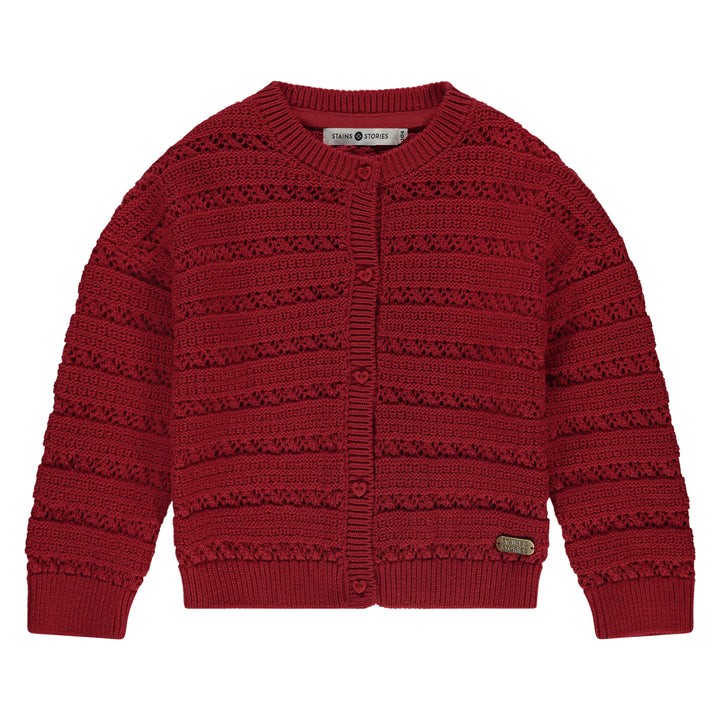 Red knitted cardigan on a white background