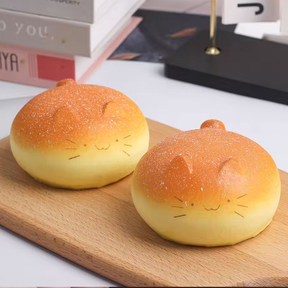 two catbread squishy toys on the counter