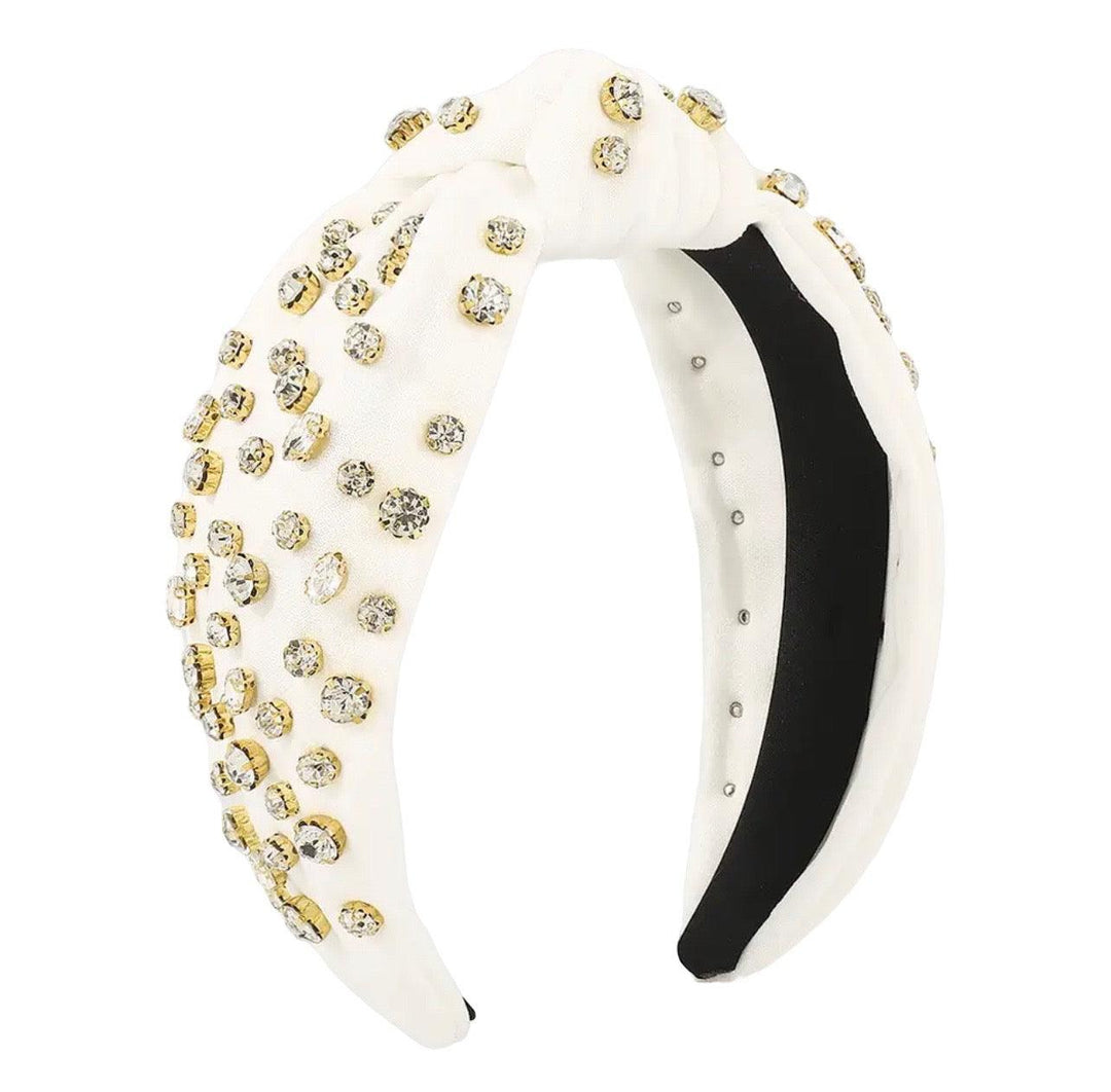 knot headband with rhinestones sewn on in white. 