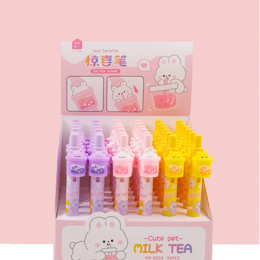 retractable pens in purple, pink and yellow colorways. each with a boba pen and a cat on top