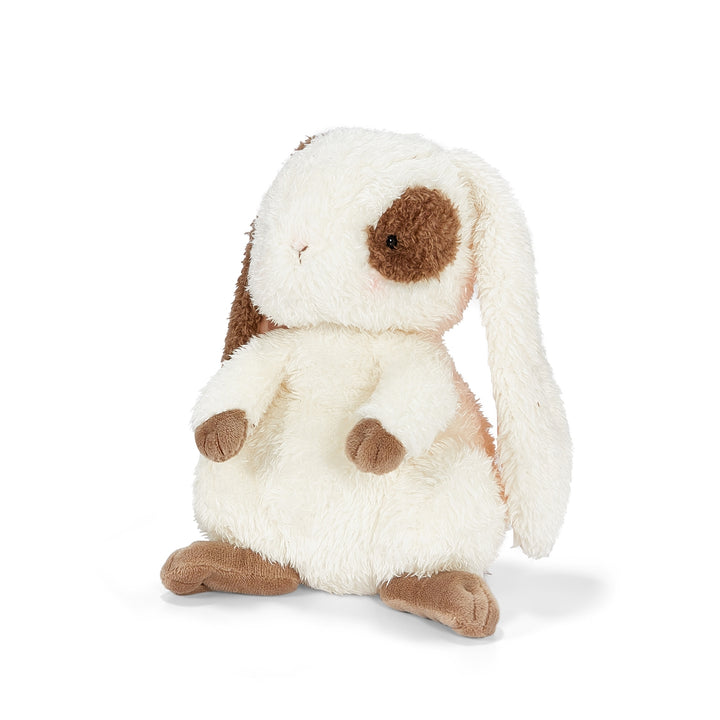 Plush toy rabbit with brown ears and paws on a white background