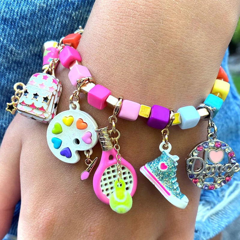 assortment of charms on a bracelet. example of a collection of them. 