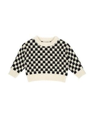 black and creme check sweater. long sleeve and hits at the waist. 