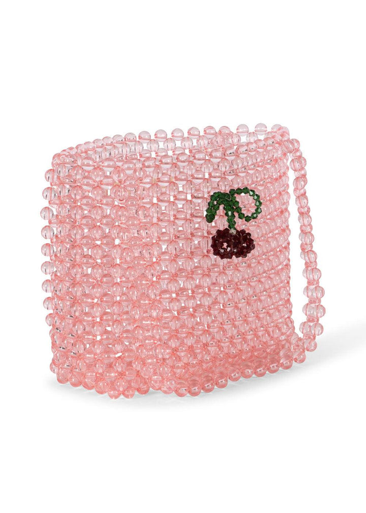 beaded pink bag with beaded cherries attached to the front. 