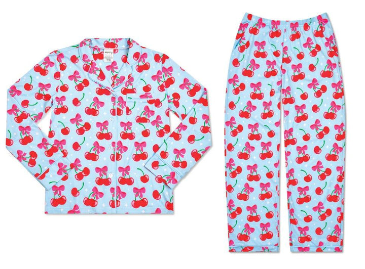 loungewear set: top is long sleeves and bottoms are long pants. blue base color with red cherries and pink bow that ties the cherries together