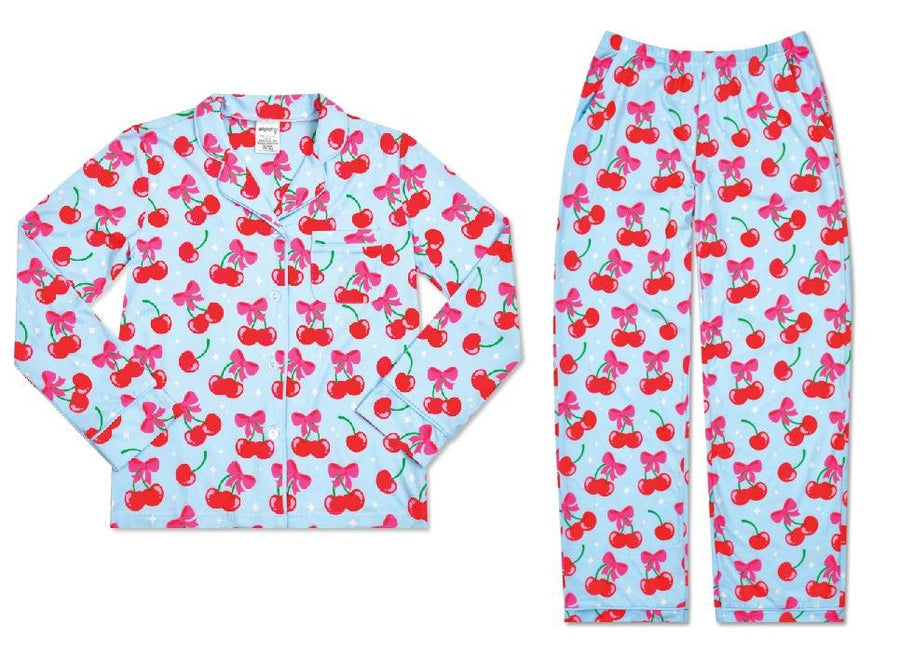 loungewear set: top is long sleeves and bottoms are long pants. blue base color with red cherries and pink bow that ties the cherries together