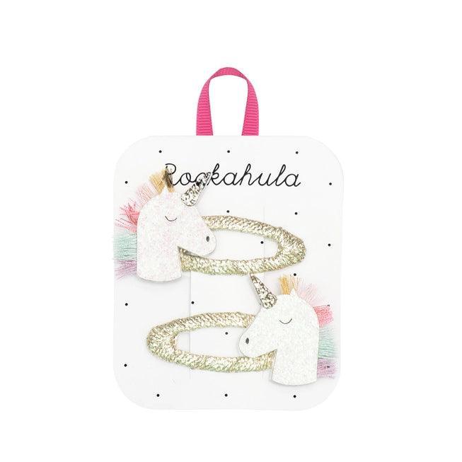 set of 2 unicorn clips, each with rainbow hair. the snap clips are wrapped in gold thread. 