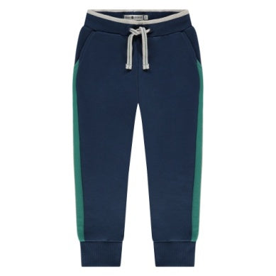 navy pants with green stripes on the side. coordinates perfectly with the color blocking sweatshirt in the listing. 