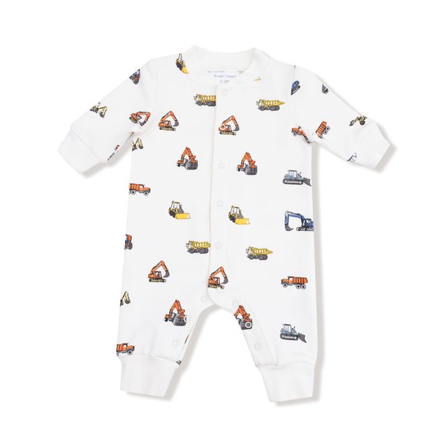 White baby onesie with construction vehicle pattern on a white background