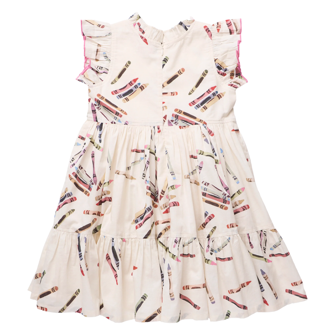 A sleeveless tiered dress for toddlers or girls, featuring an off-white/cream base with a colorful crayon print and pink ruffled trim along the shoulders.