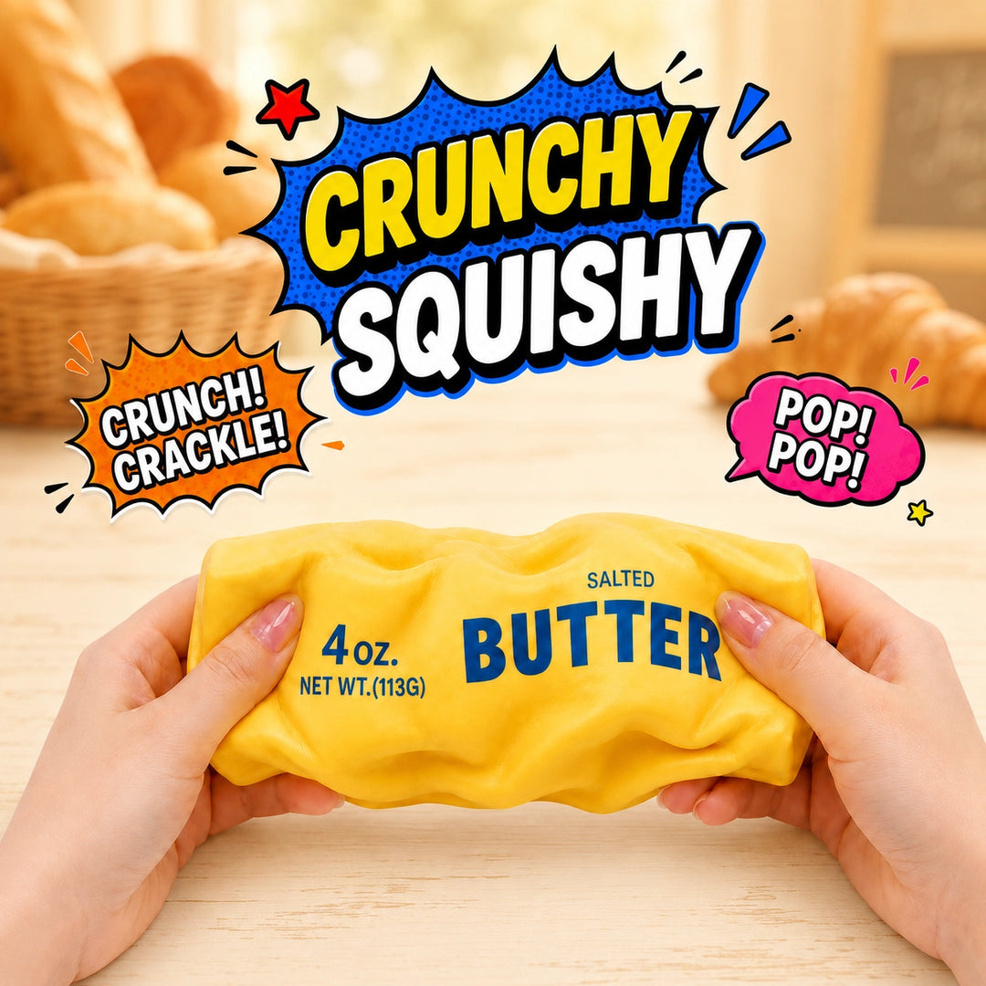 Hands holding a yellow novelty squishy toy shaped like a butter package, with comic-style text overlays reading 'CRUNCHY SQUISHY' and 'CRUNCH! CRACKLE! POP! POP!'.