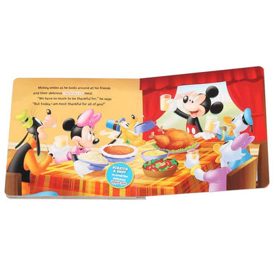 inside of the book showing Mickey and friends eating dinner together