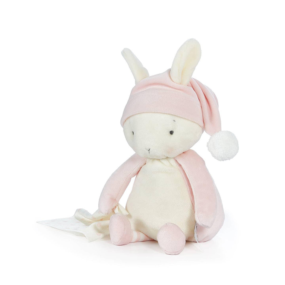 white bunny sitting on an angle with pink arms and legs and wearing a pink hat 