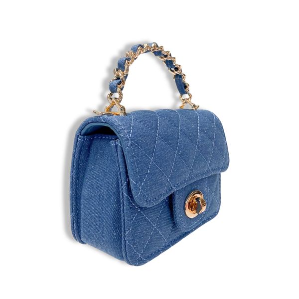 Denim Blue quilted handbag with gold chain handle on a white background