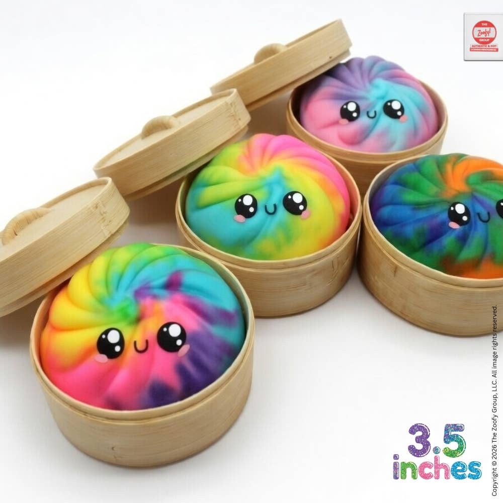 Colorful tie-dye products with cute faces in wooden containers on a white background