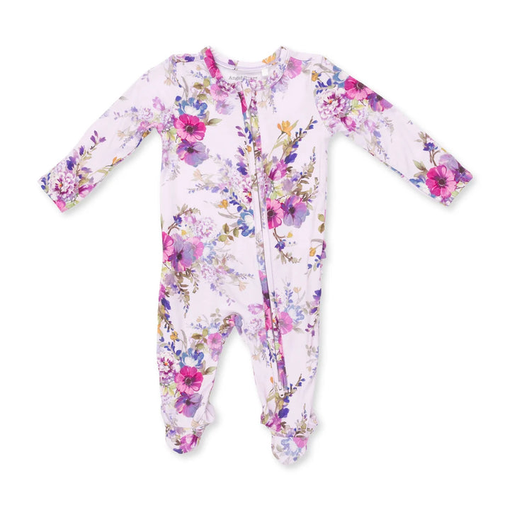 A baby long-sleeve footed sleeper with a pink and purple floral print on a white background, laid flat on a white surface.