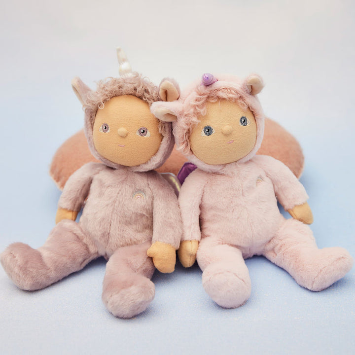 Two plush toys dressed as unicorns 