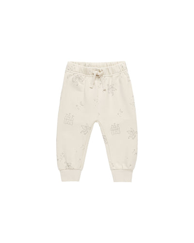 beige sweatpants with drawstring with age green dragons and castles printed all over. 