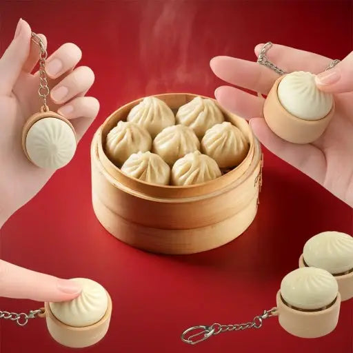 Bamboo steamer with dumpling keychains on a red background