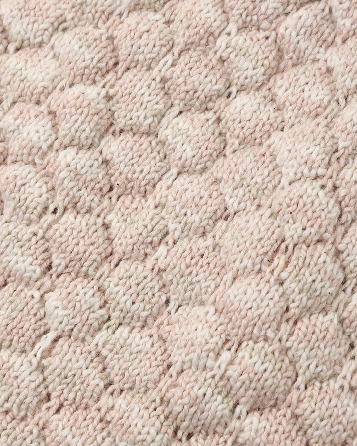 close up of the light pink texture on the cardigan