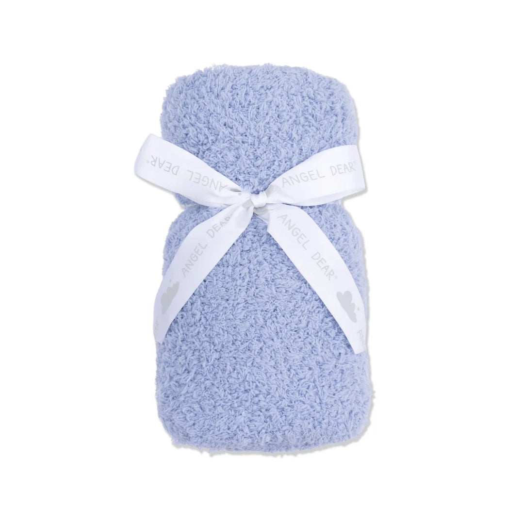 Blue chenille blanket with a white ribbon on a white background