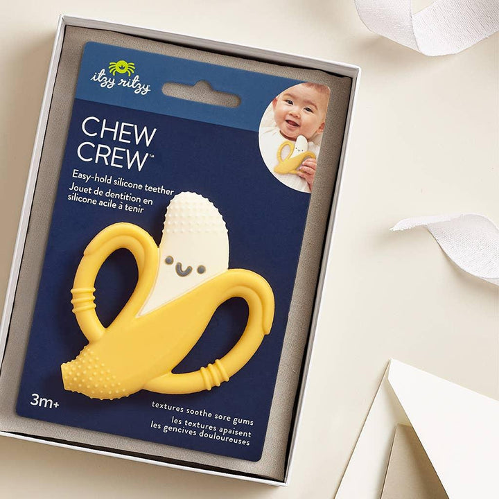 banana teething toy on cardboard packagaing. 