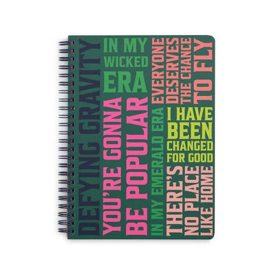 spiral notebook with quotes from Wicked the movie/musical on it. Including "Youre gonna be Popular" and "Defying Gravity" 