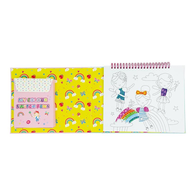 this picture shows you the fairies in a coloring page with markers on the other side of the book. 