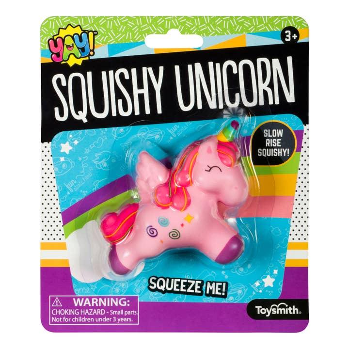 squishy unicorn toy. unicorn is pink with purple hooves and rainbow color horn. 