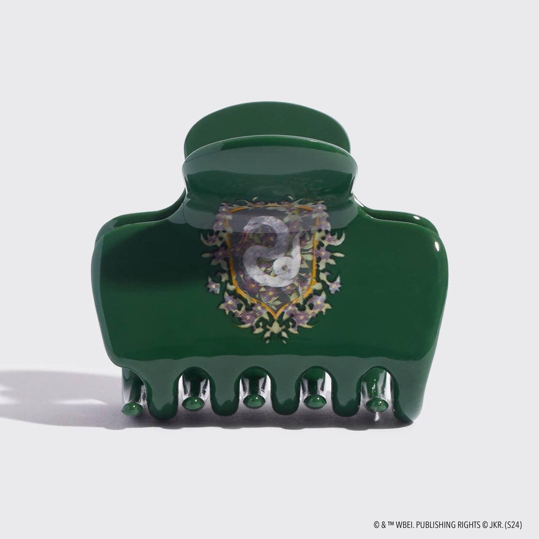 claw clip with the crest of slytherin on the front of the clip 