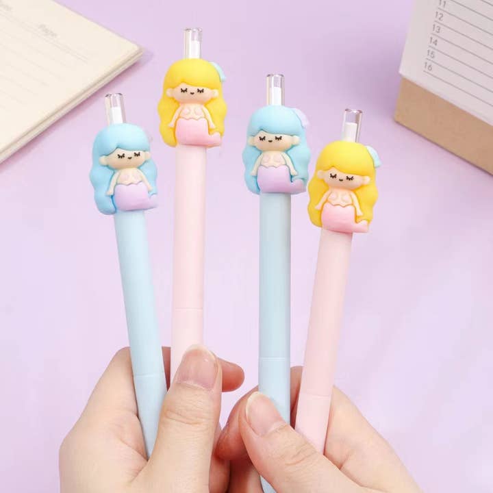 retractable pencil with pink pencil and yellow hair mermaid on one pencil and a blue pencil with blue hair atop the blue pencil