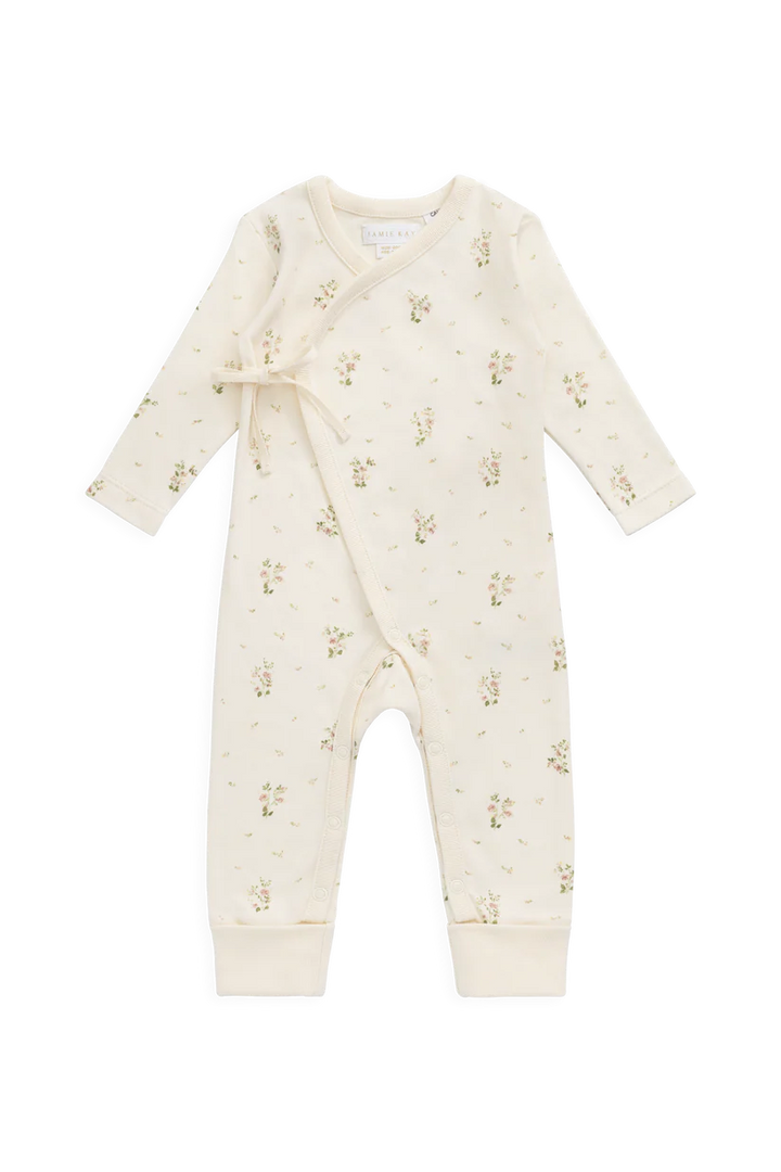 Baby romper with a tiny floral pattern on a white background