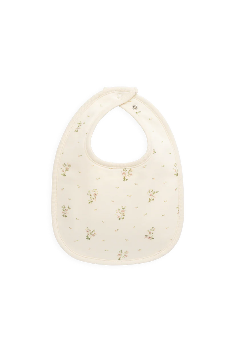 Baby bib with floral pattern on a white background