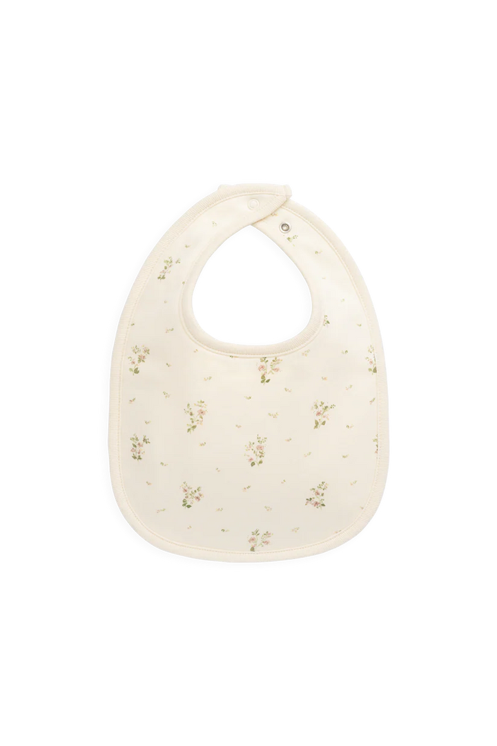 Baby bib with floral pattern on a white background