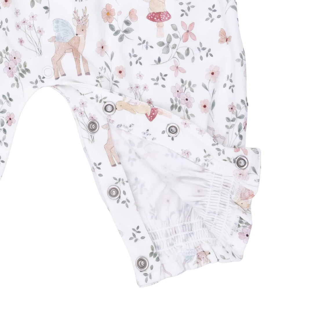 Floral and animal patterned fabric with deer and butterfly design on a white background