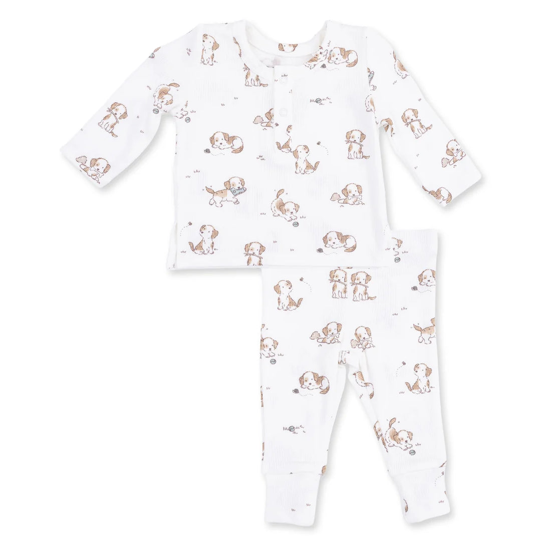print of little puppies playing on a white baby outift