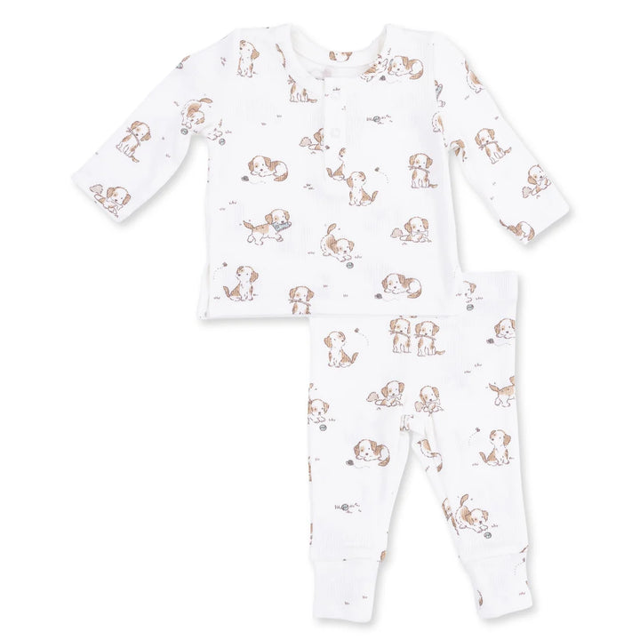 print of little puppies playing on a white baby outift